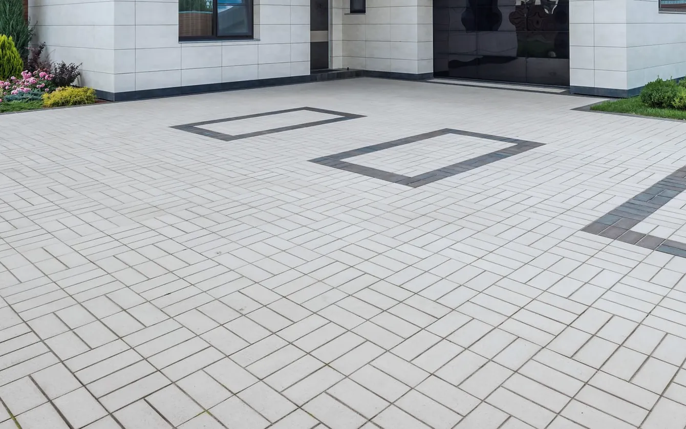 Paved driveway shown weathered and then clean — after