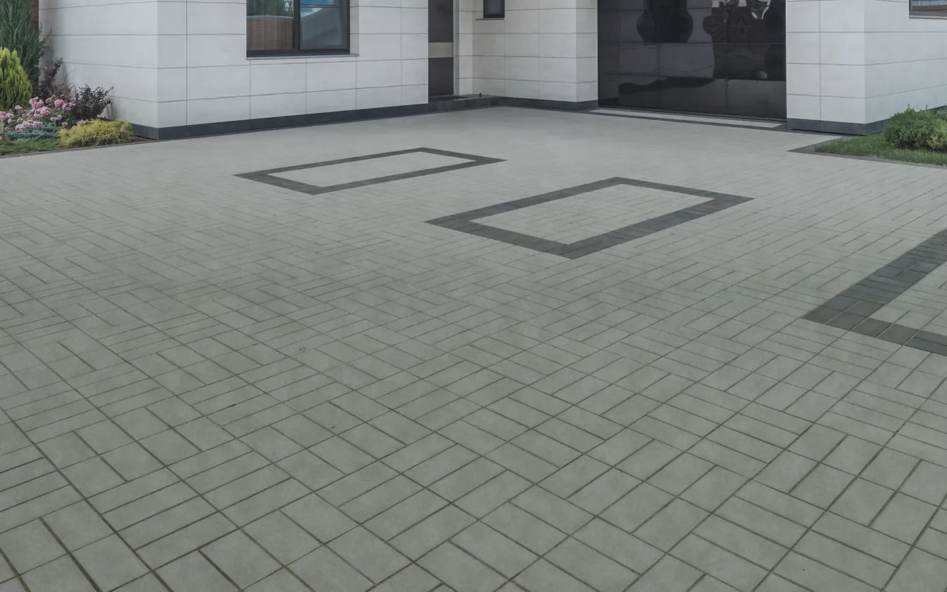 Paved driveway shown weathered and then clean — before