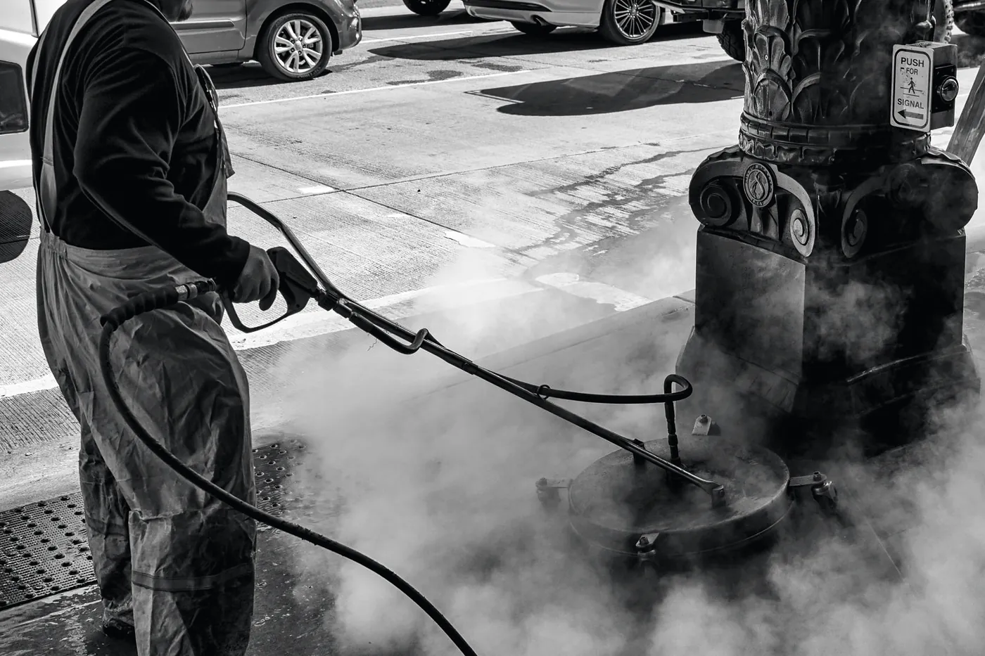 Operator working a commercial pressure washer